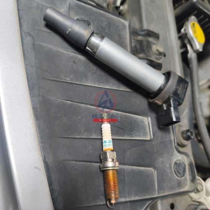 penyebab busi mobil basah oli
